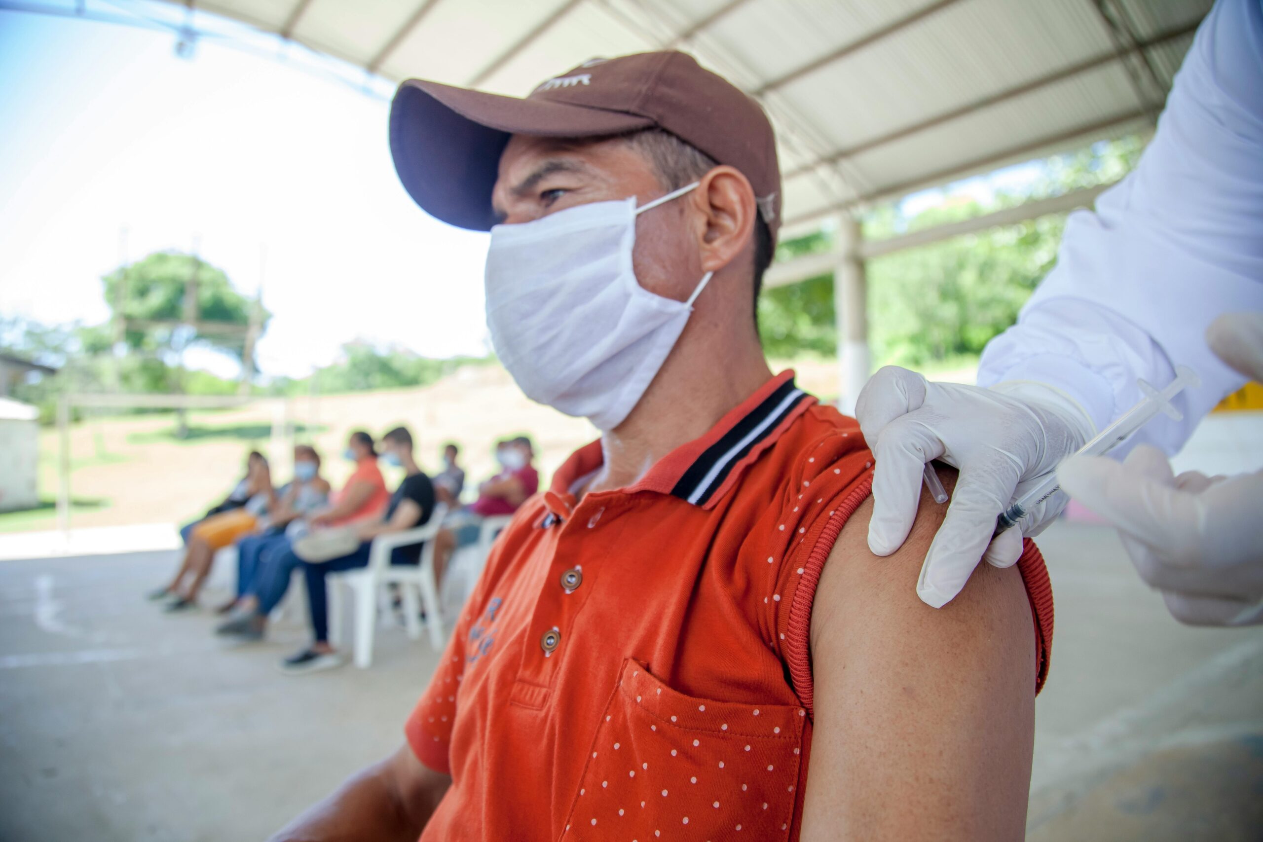 Man receives COVID-19 vaccine in outdoor clinic in Bolívar, Colombia.